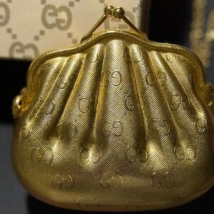 Guccj RARE VINTAGE gold shell clutch. 

4x1.75x4
